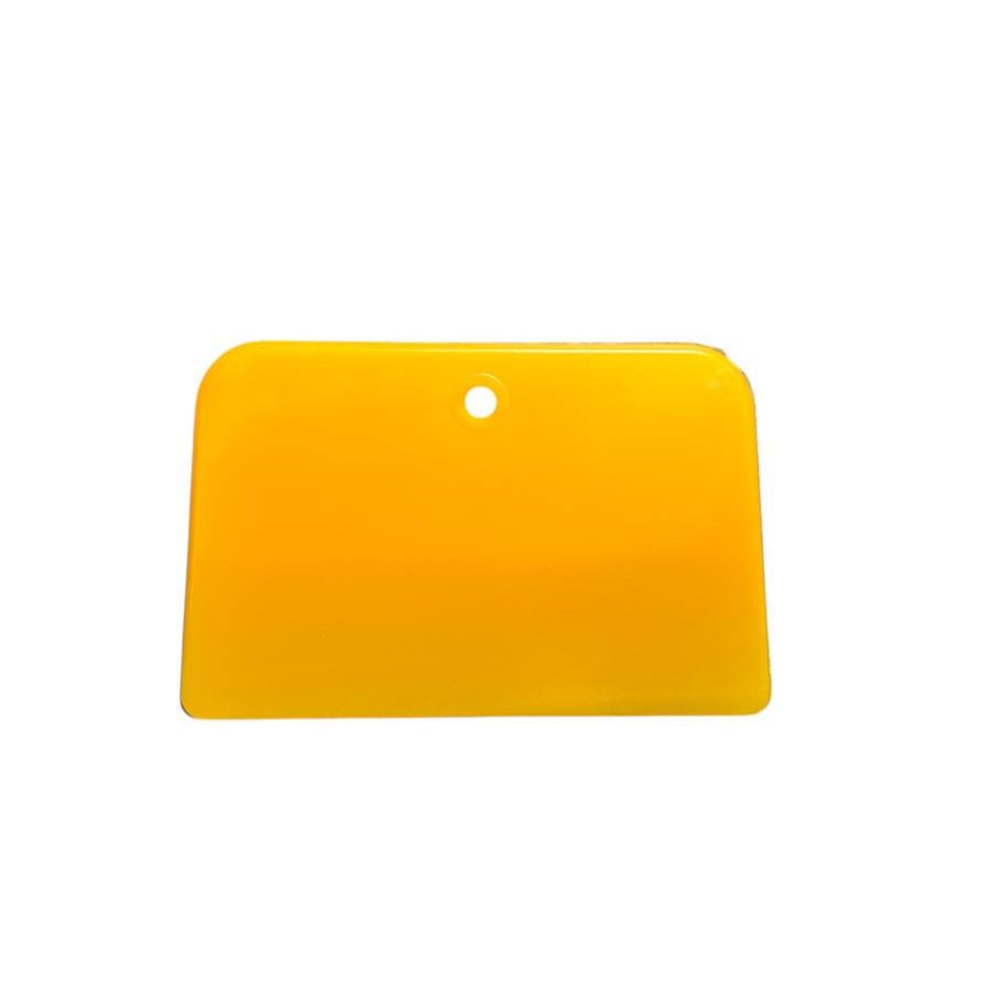 Yellow flat spatula for smoothing and leveling bathtub refinishing coatings.